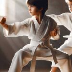 A young boy in a white Karate uniform practicing Kata moves.