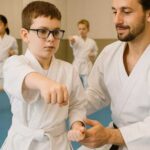 Autistic child practicing karate with instructor guidance